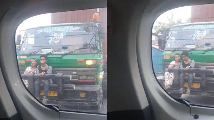 pasangan duduk di bumper truk (2)